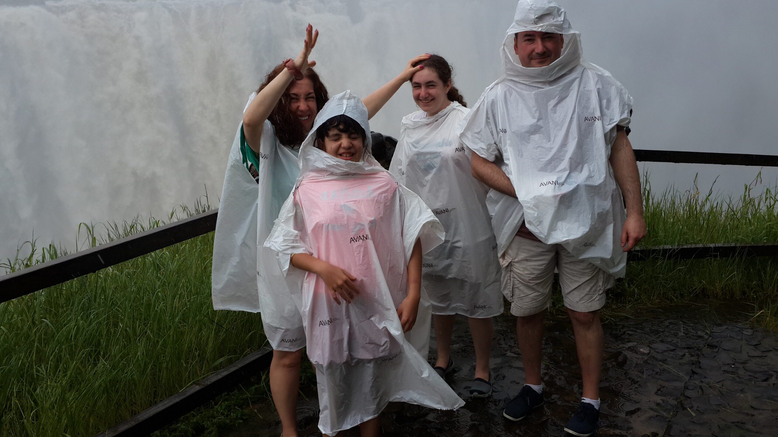 Family exploring Victoria Falls in Livingstone, Zambia